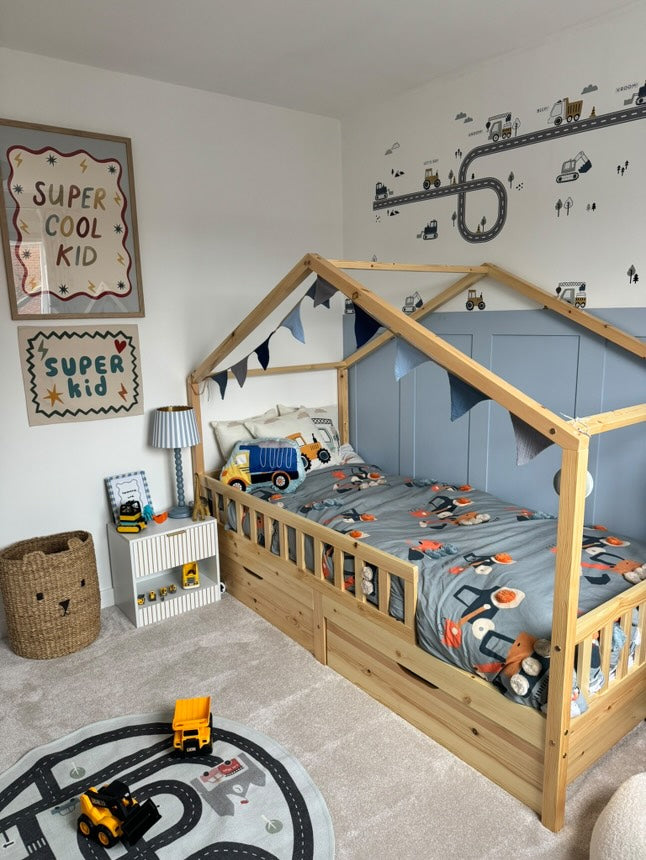 Bright and cheerful nursery featuring peel-and-stick truck, tractor, and digger wall stickers, designed to transform your child’s room easily